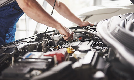 mechanic working on engine